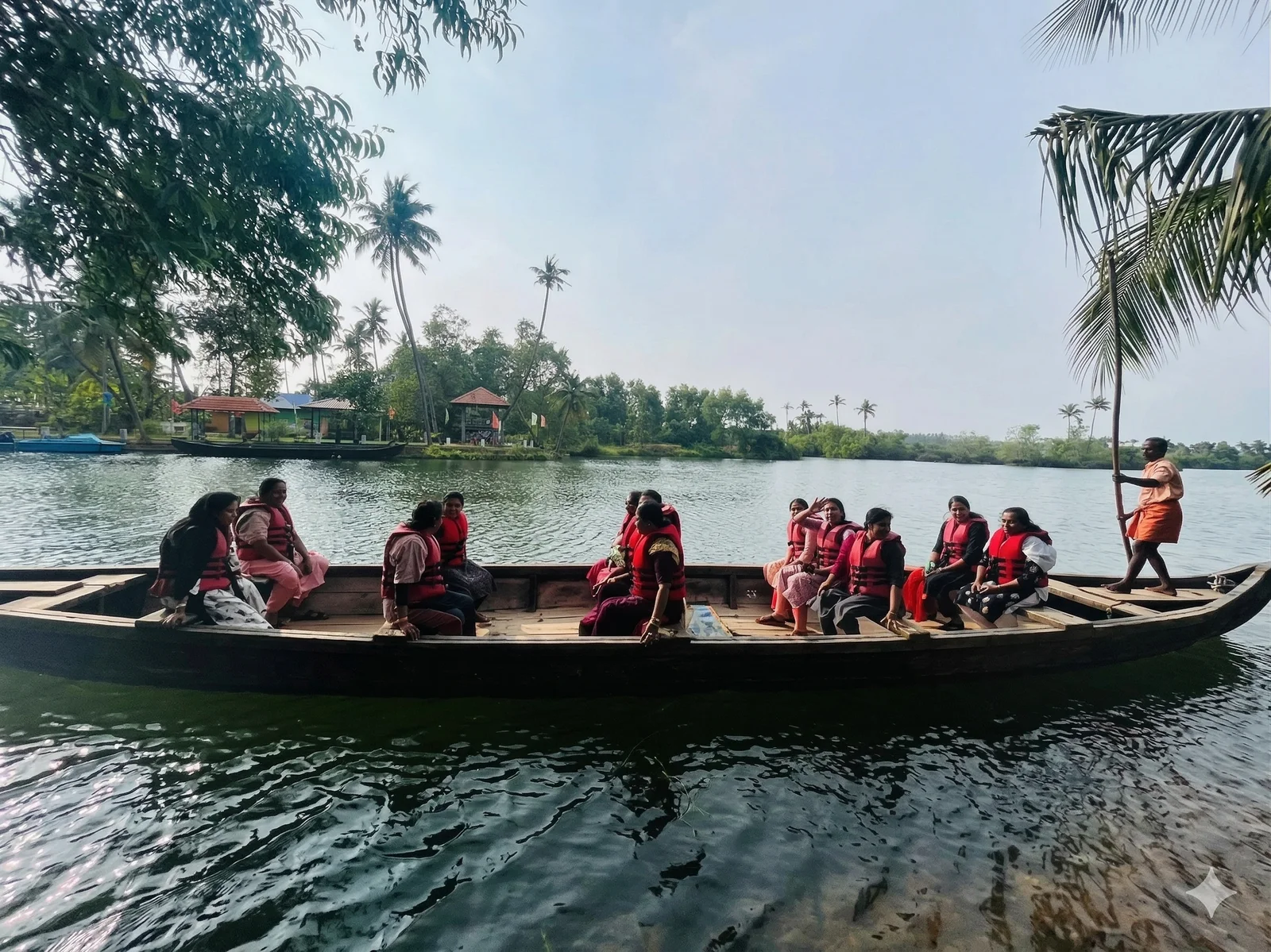 Traditional country boat tour through Paravur mangrove backwaters near Varkala, Kerala